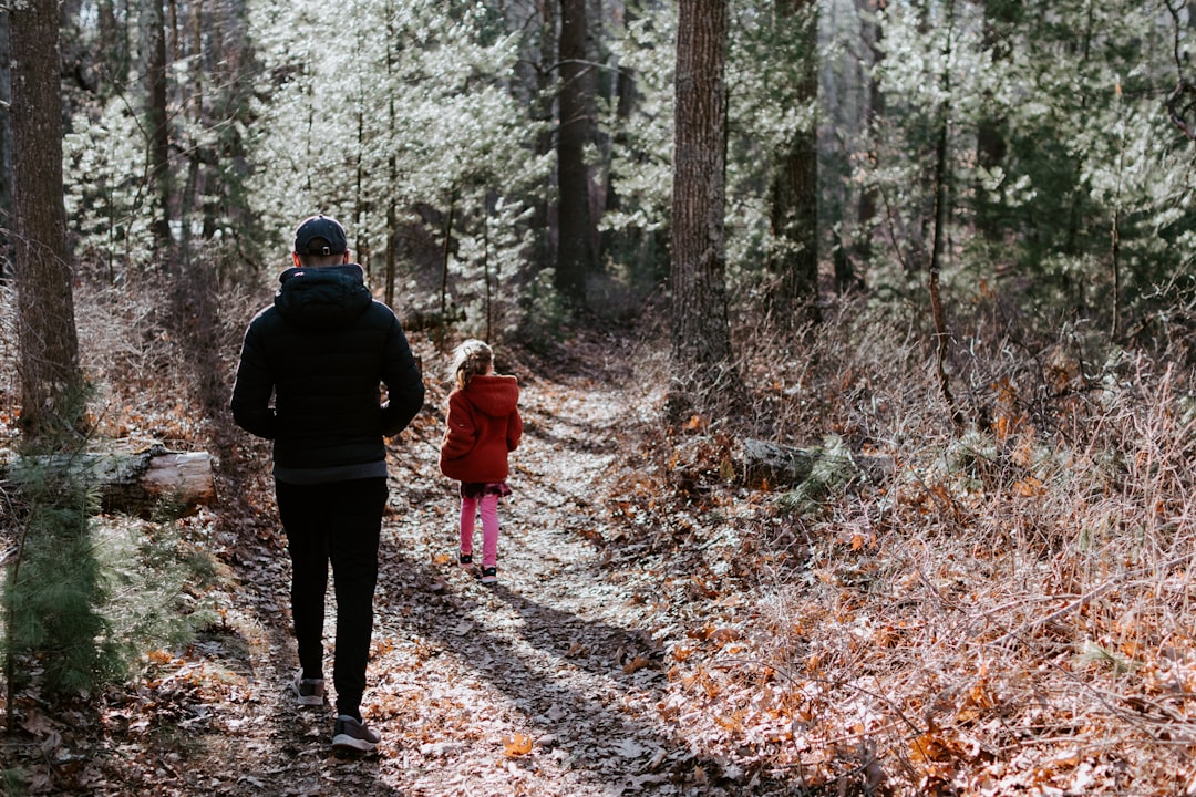 Man in Black Jacket and Black Pants Standing in the Middle of Forest During Daytime MpItbN6K398